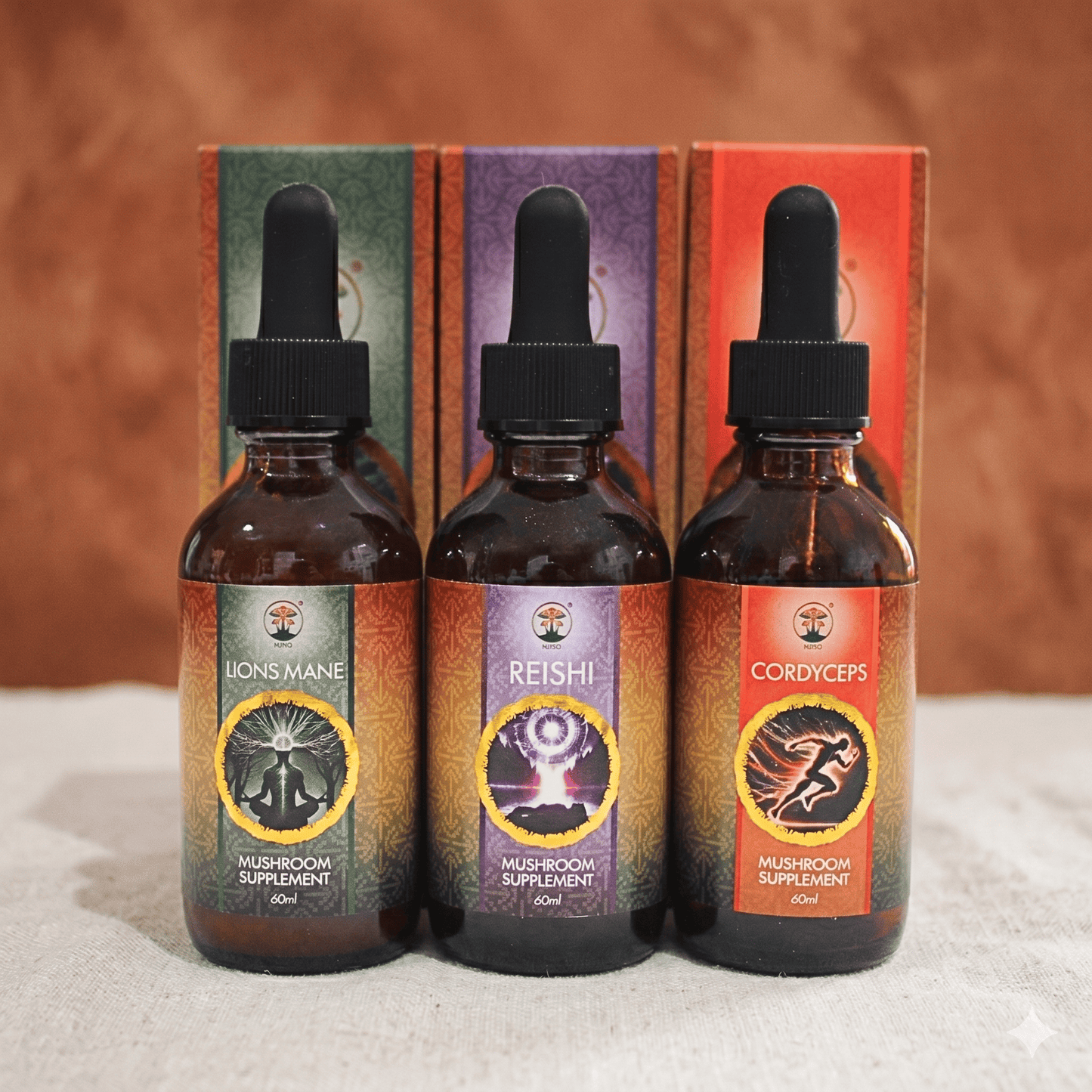 Three bottles of mushroom supplement. Lions mane, Cordyceps and Reishi with droppers in front of their packaging on a textured surface.