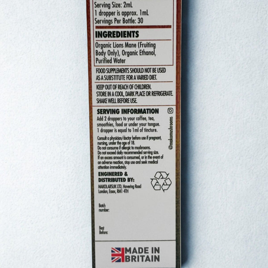 Back of a supplement bottle with serving information and ingredients on a light gray background