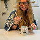 Mako's Lions Mane Mushroom tincture being taken by customer